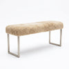 Honey shearling sheepskin bench on a satin nickel cube base, three quarter view